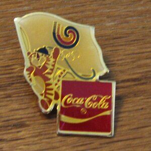 Coca - cola lapel pin for the Olypmics